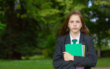 Teenage girl in school uniform