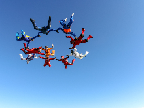 Group of people skydiving together