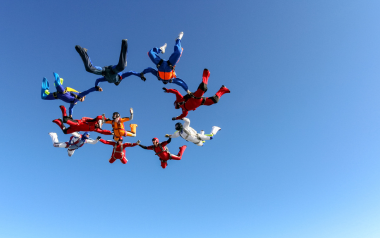 Group of people skydiving together